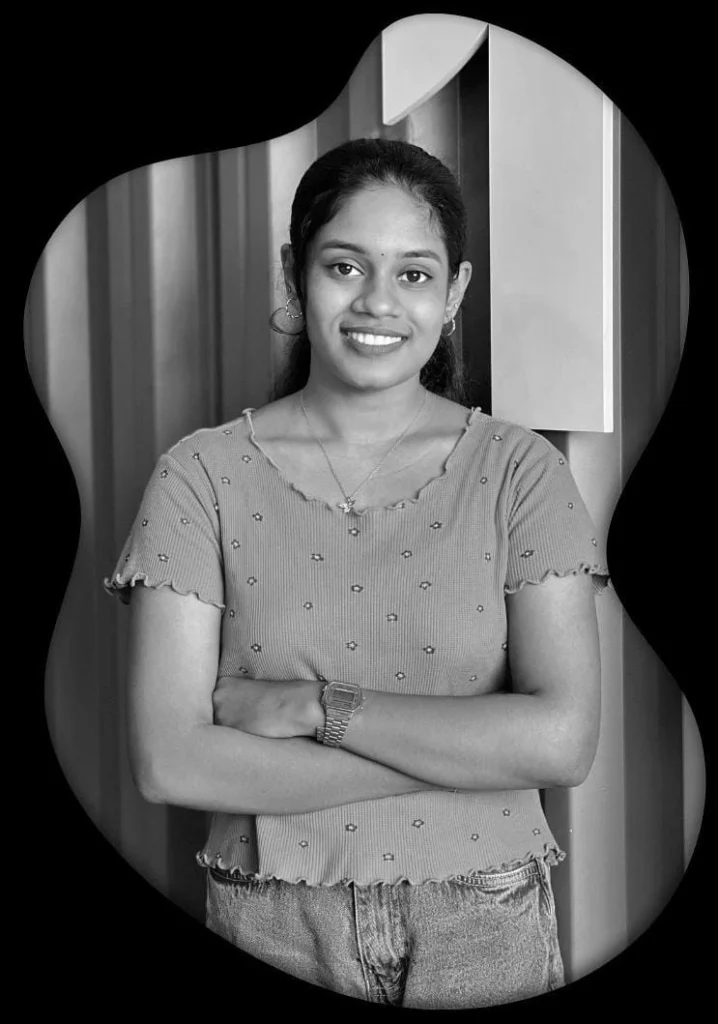 Portrait of Anjana Sunil, freelance digital marketing consultant in Kannur, standing confidently with arms crossed