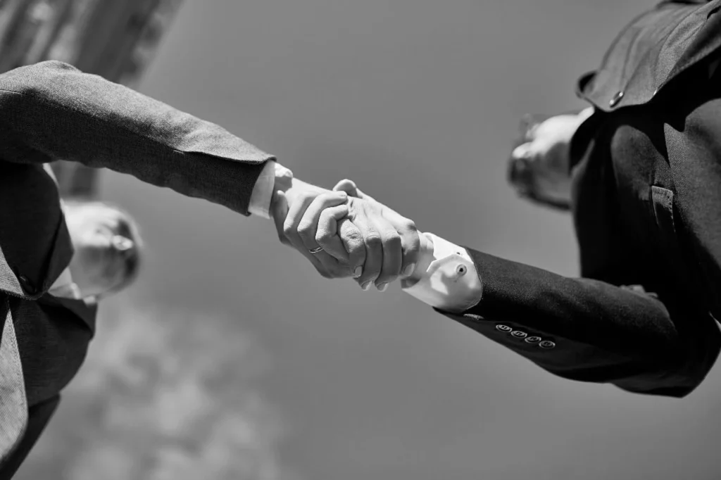 Close-up handshake between two professionals, symbolizing partnership with a freelance digital marketing consultant in Kannur Kerala